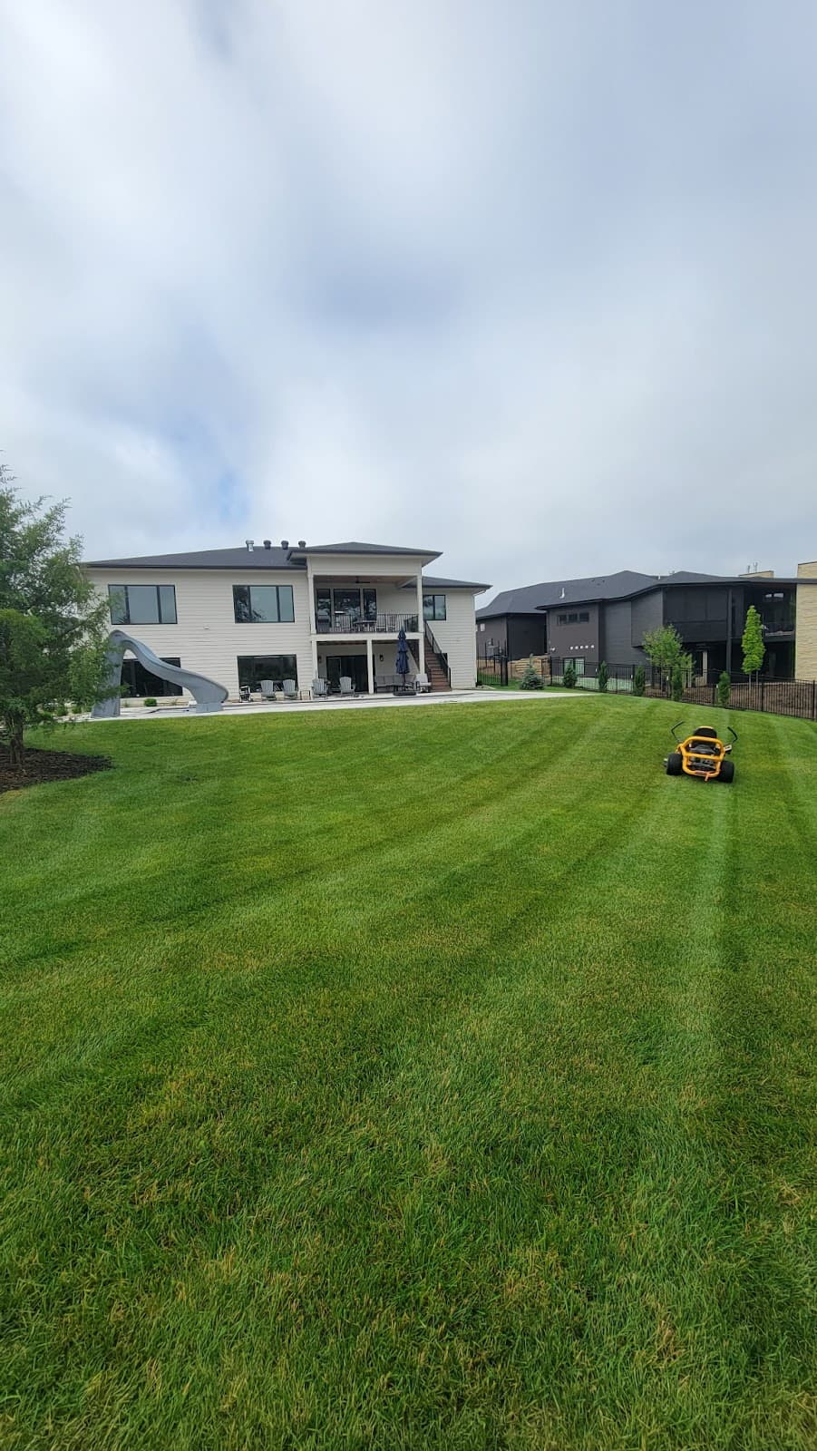 Striped lawn with clean fence-line edging — photo from Jeff Ellis's review